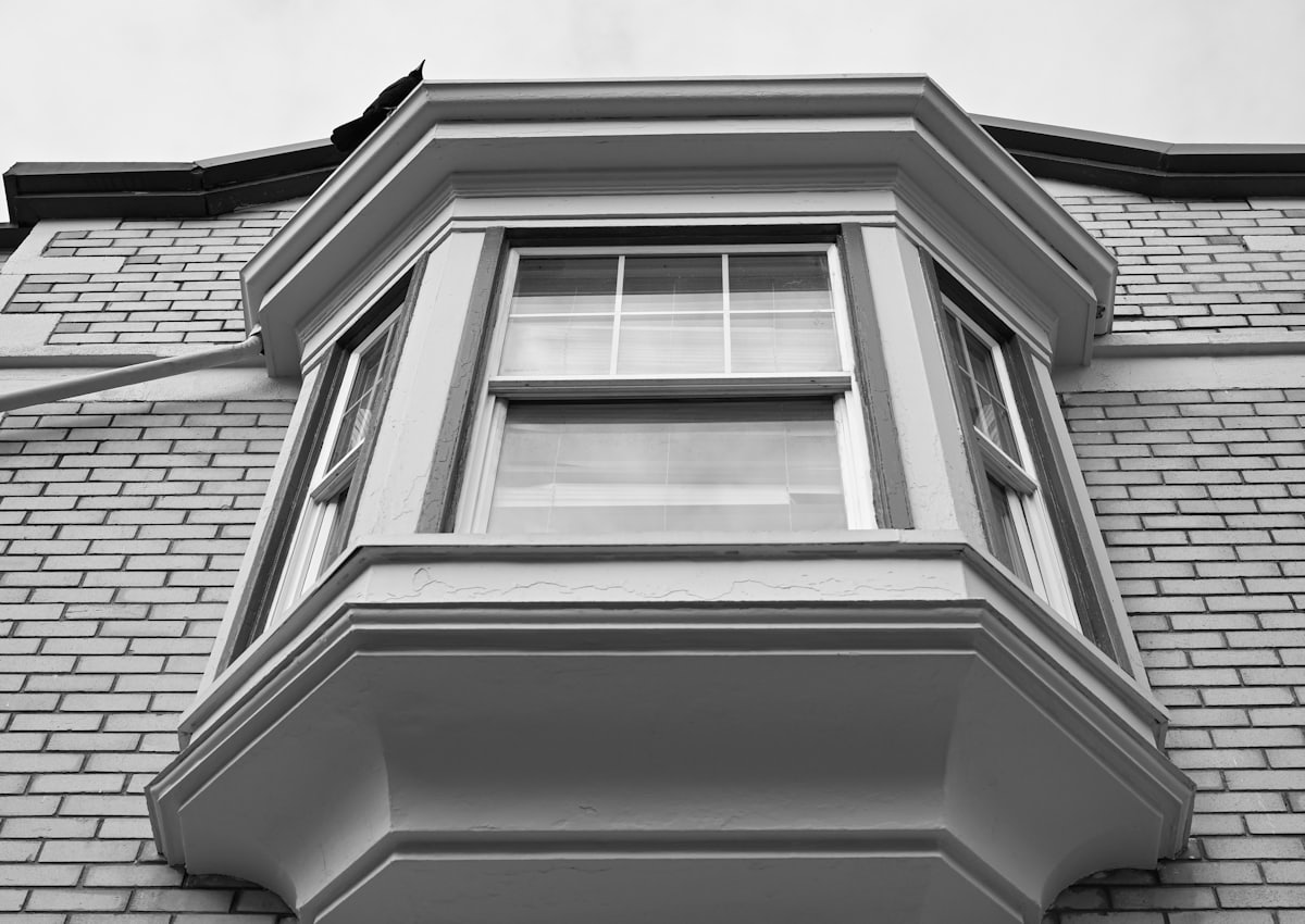 Projecting bay window on a brick elevation, viewed from below