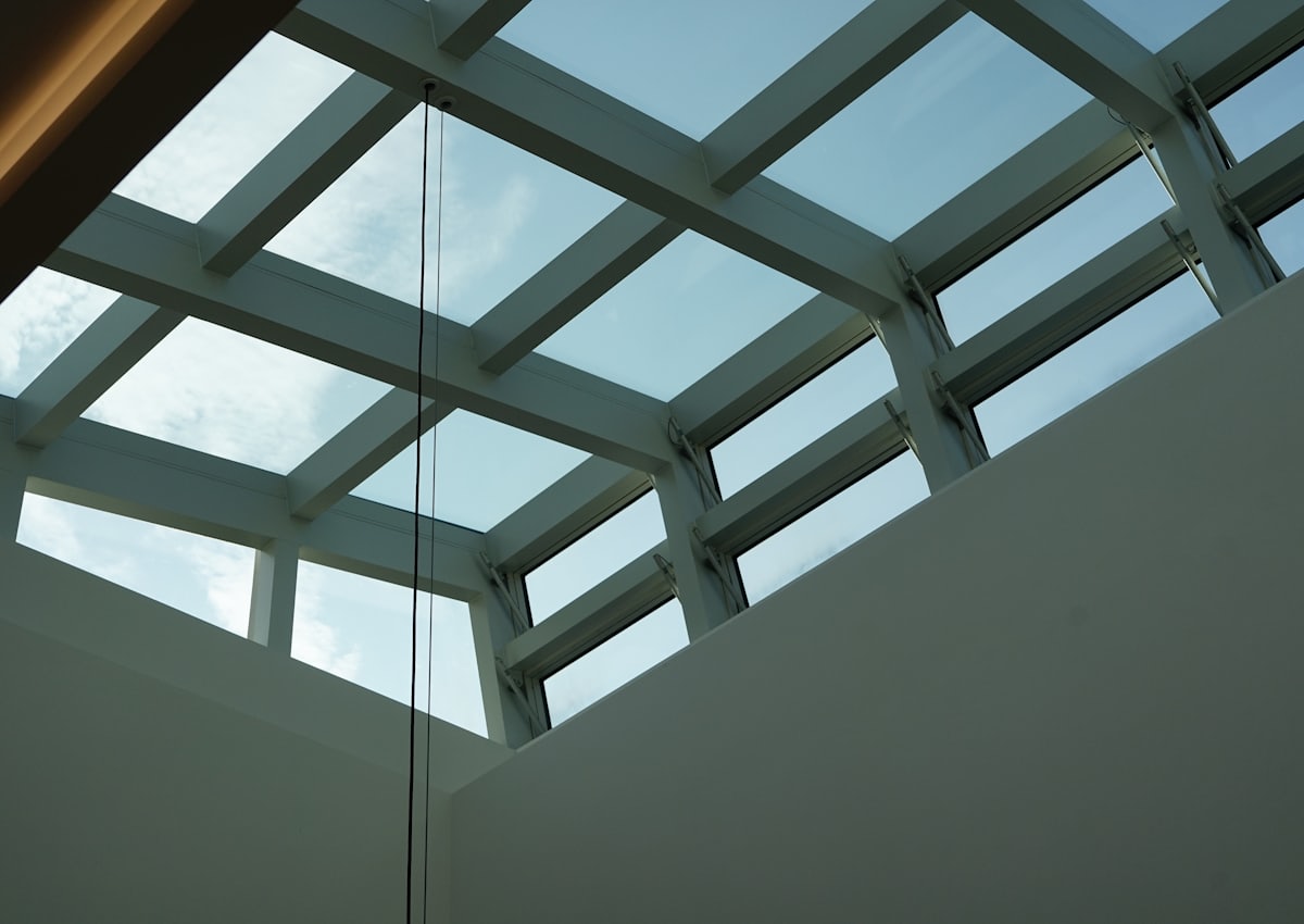 Glazed roof lantern seen from below against a blue sky
